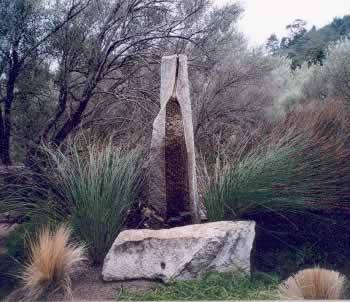 Cool gray colors of the fountain allows it to blend 